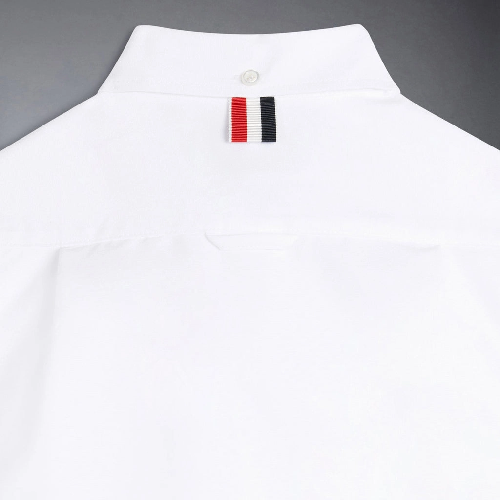 Thom Browne Kids Classic Button Down Point Collar Shirt in Solid Poplin Grid Texture Fabric Asymmetrical hem